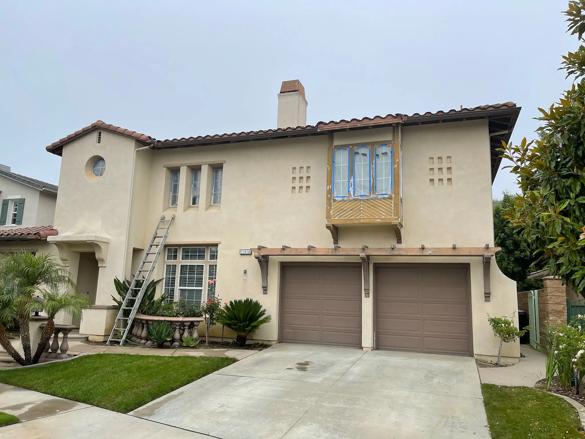 Professional painters completing a residential painting project
